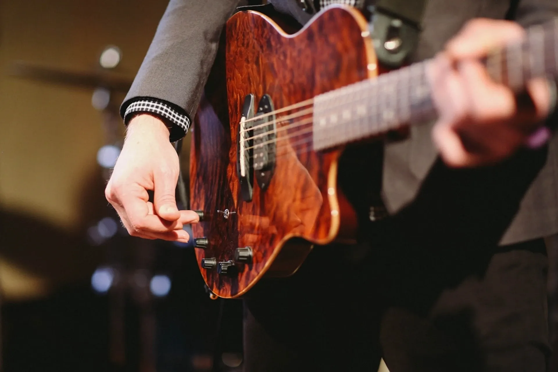 Person playing a guitar