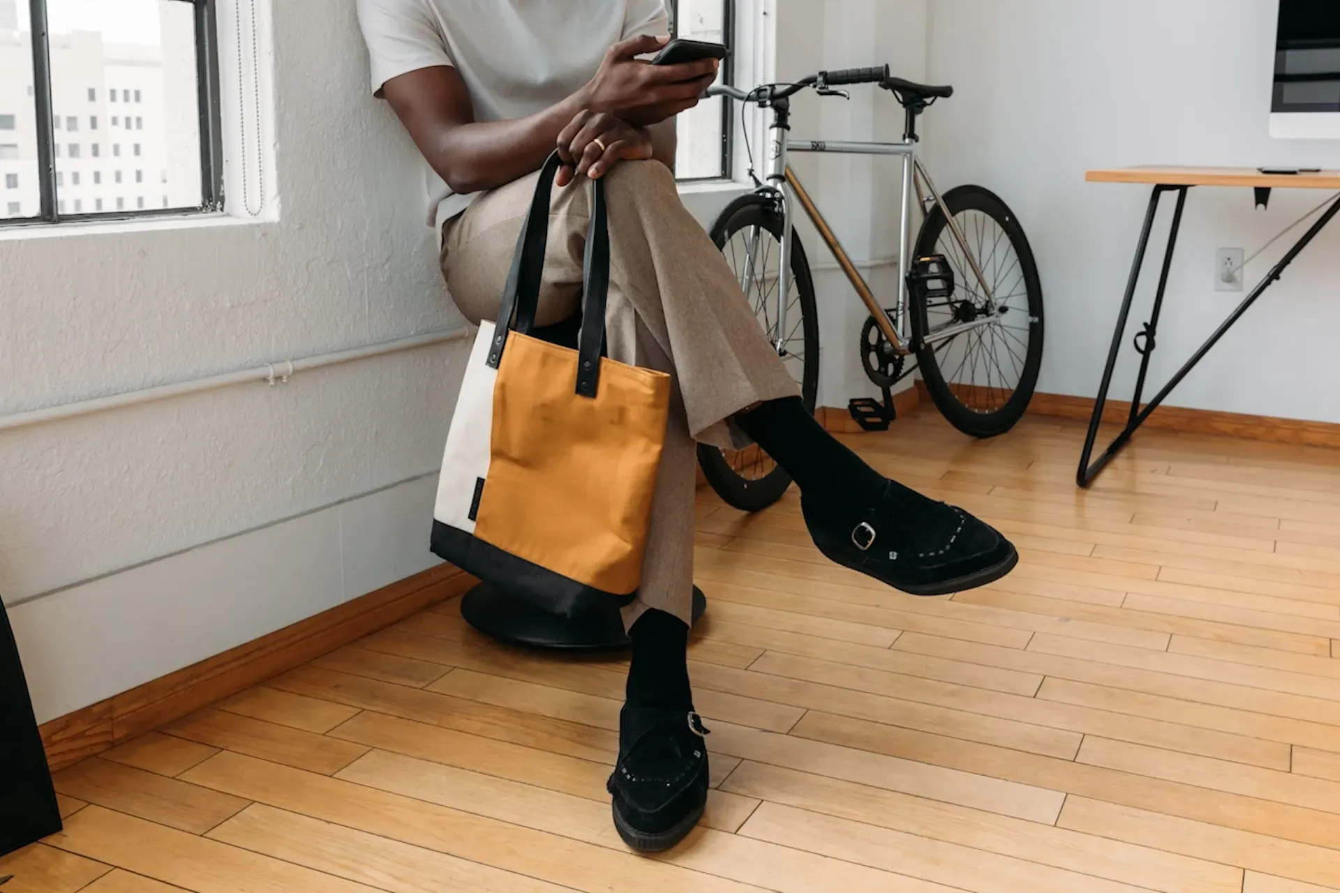 Man sitting down and using a mobile phone
