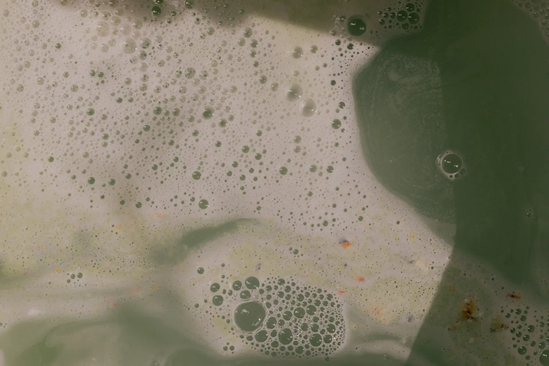Water with bubbles and foam on top