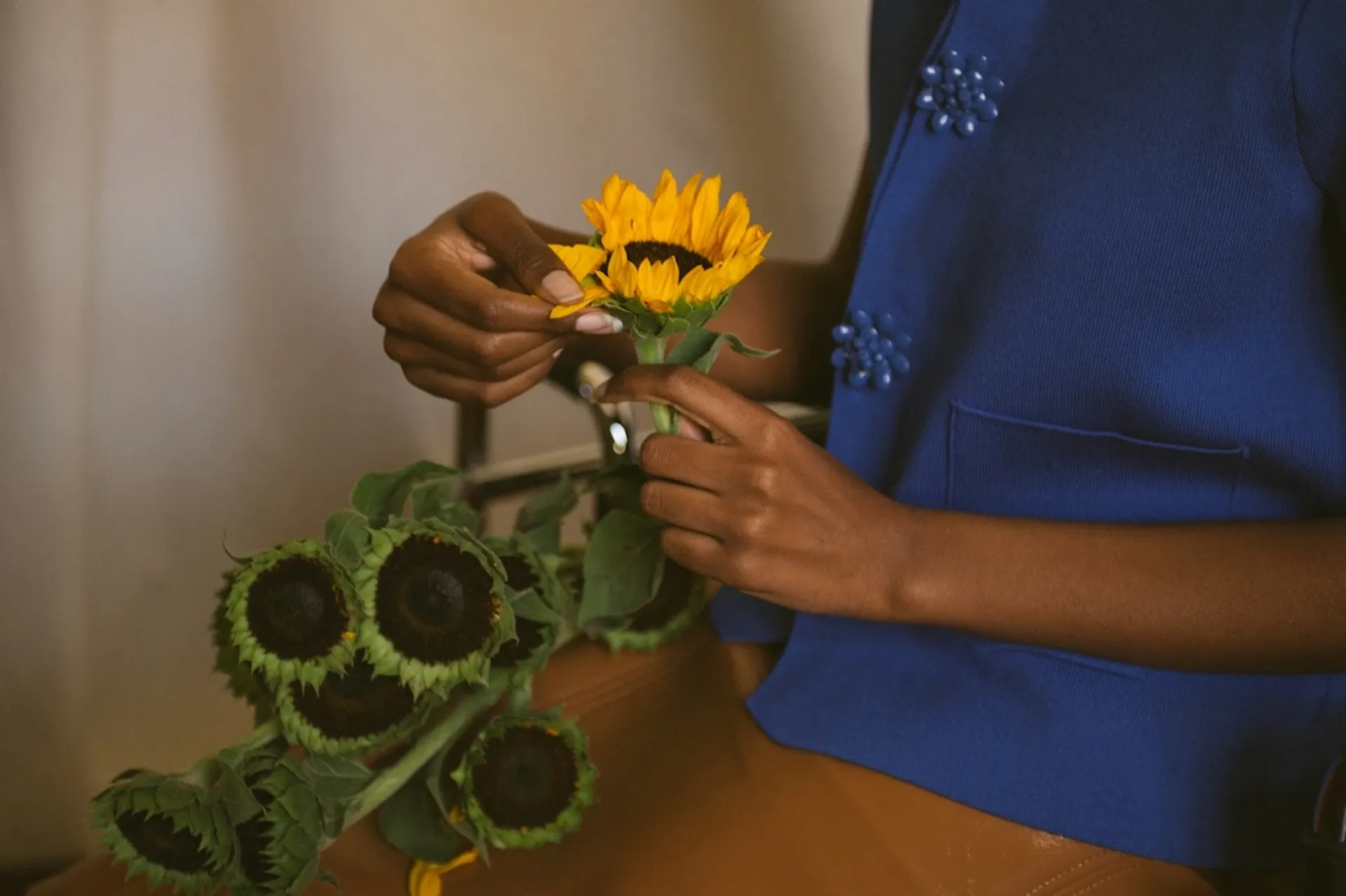 Arranging sunflowers in a bouquet