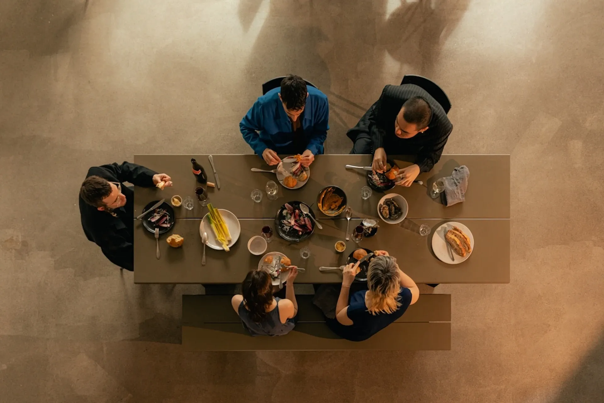 A group of friends eating at a table