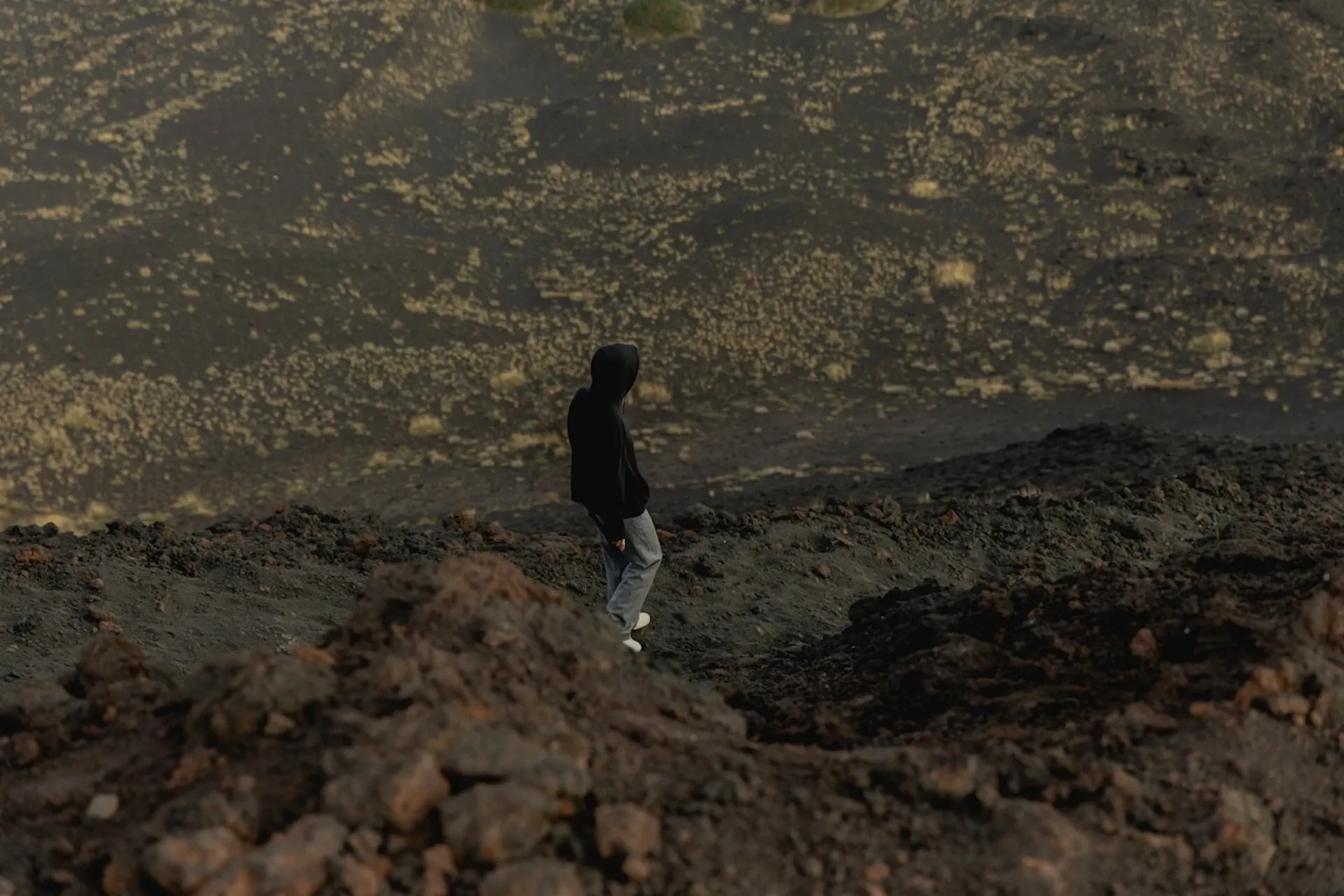 Person walking across a cliff-face