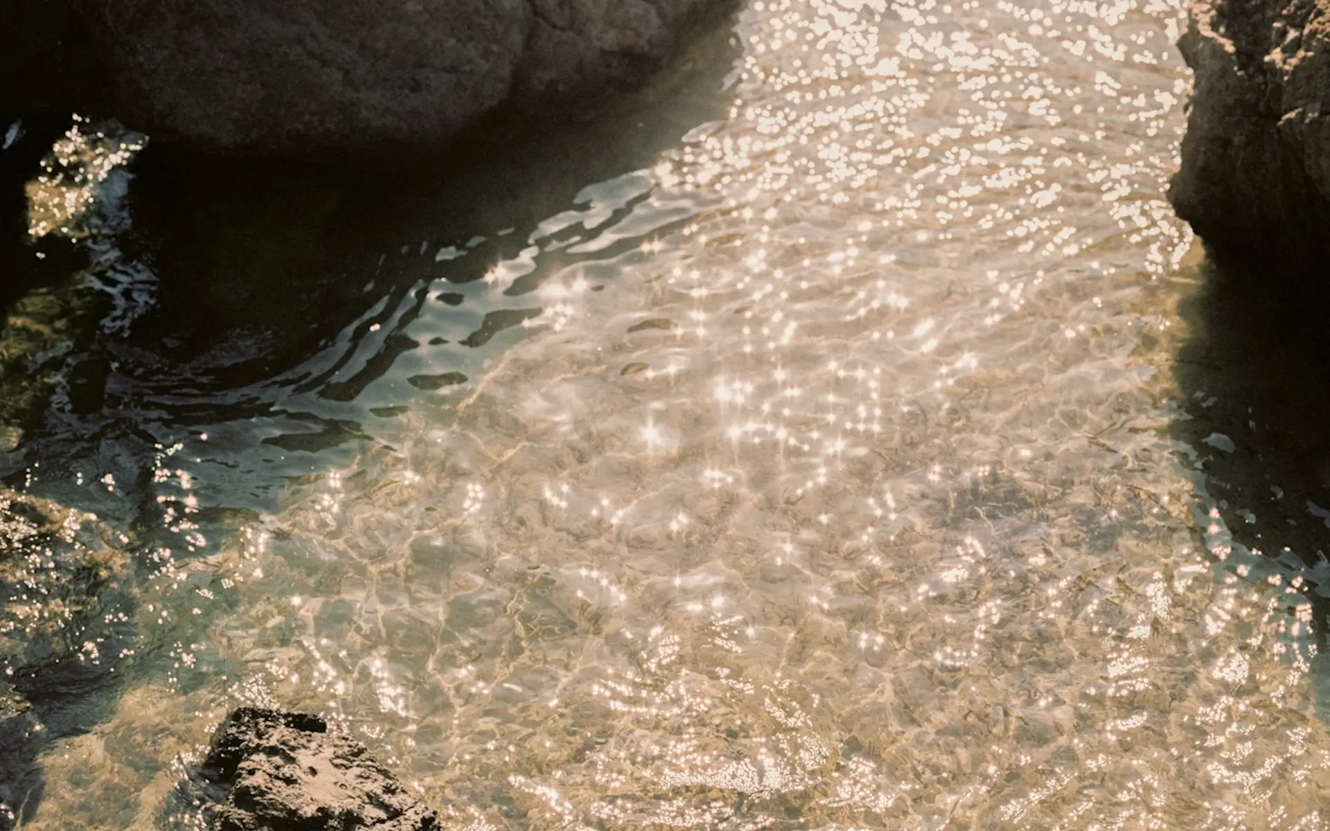 Shimmering water and some rocks