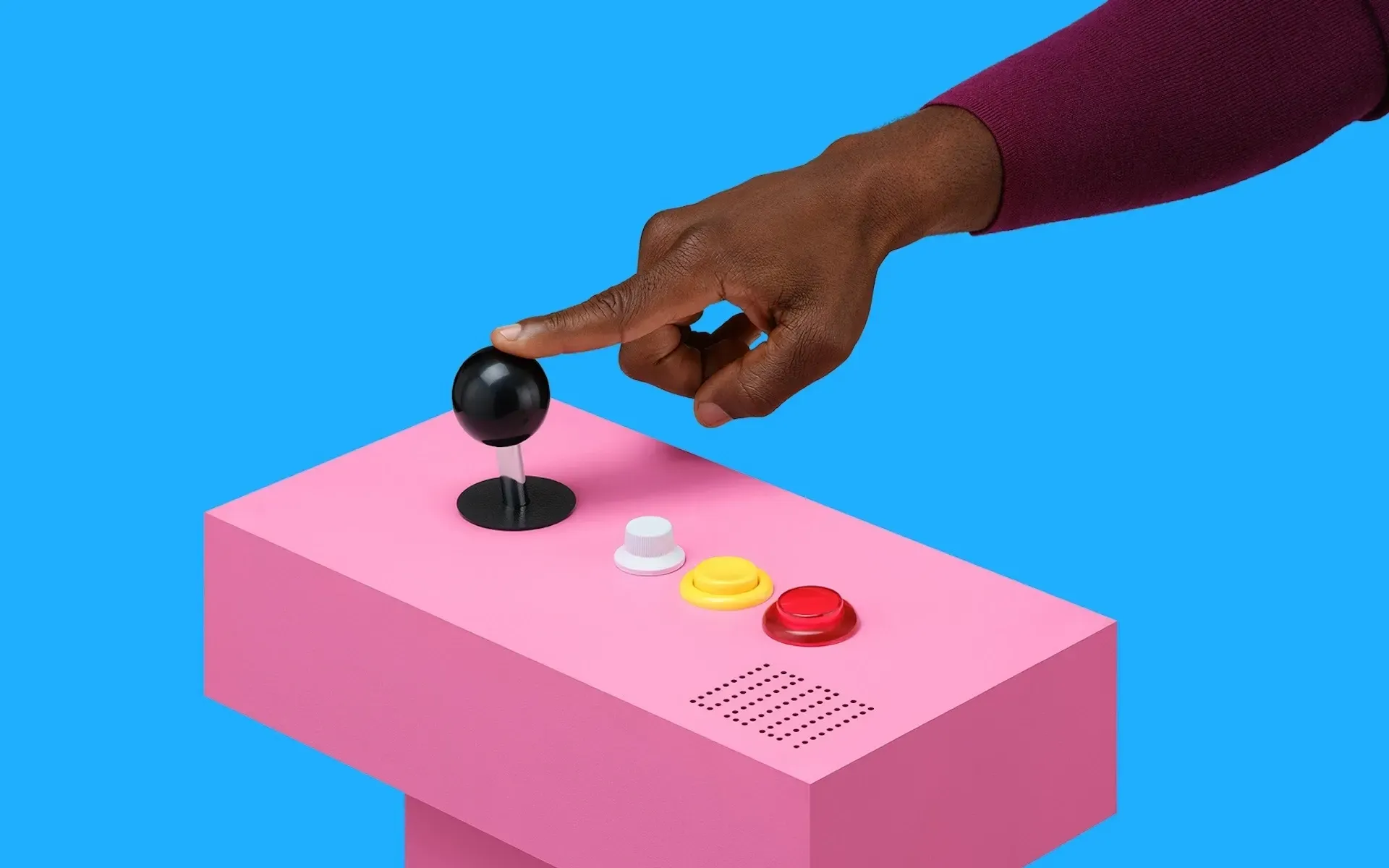 Hand pressing the button on an abstract, pink console