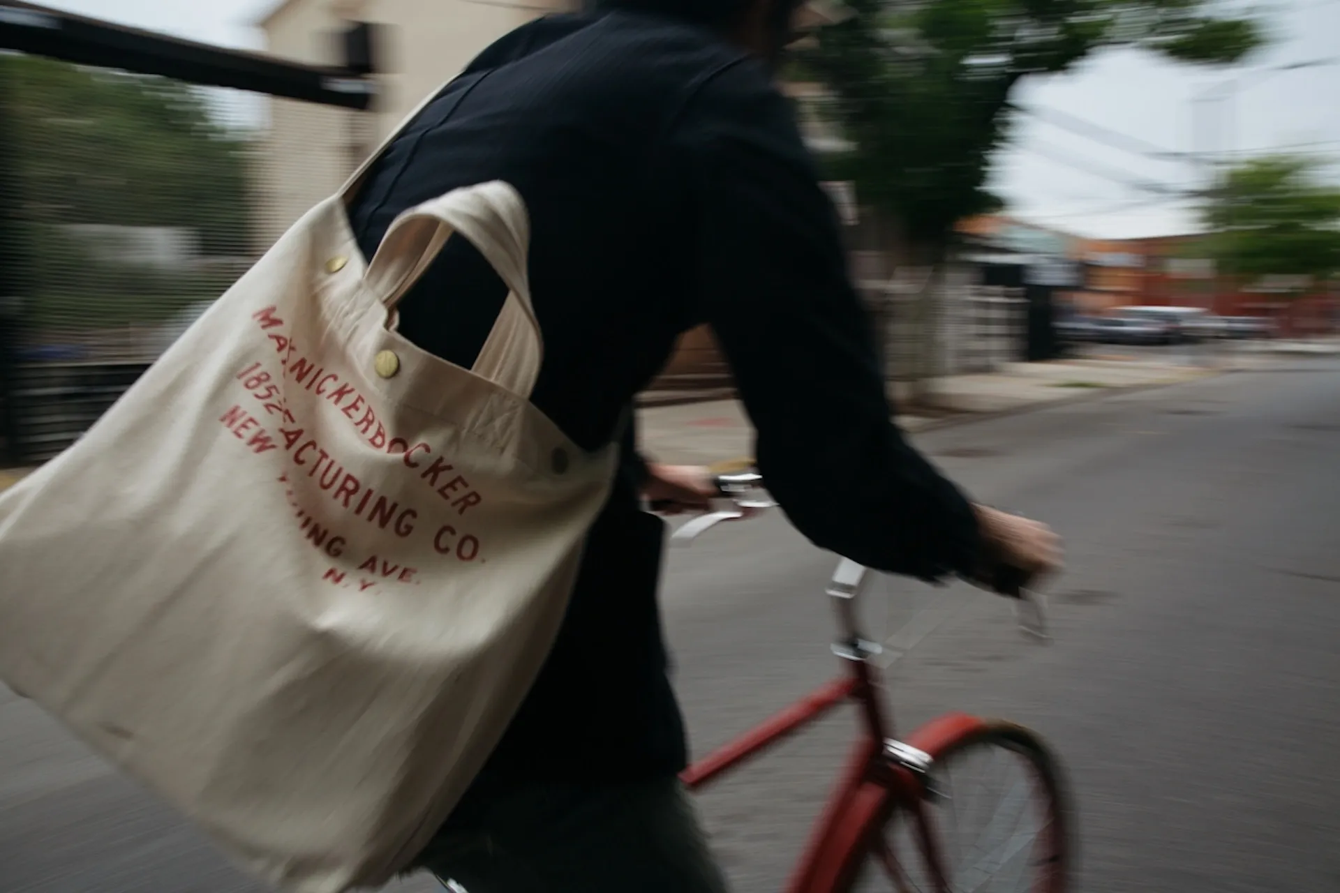 Person riding a bike through the street