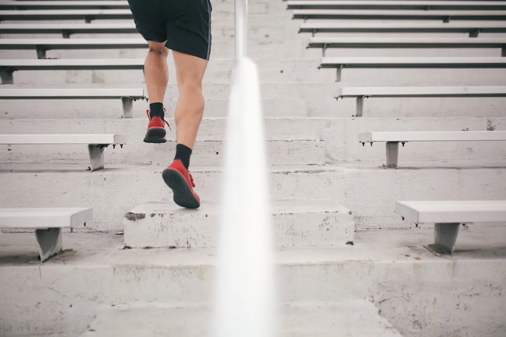 An athlete running up some steps