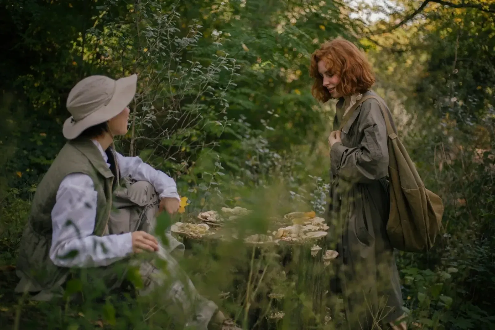 Two friends having a conversation in the woods