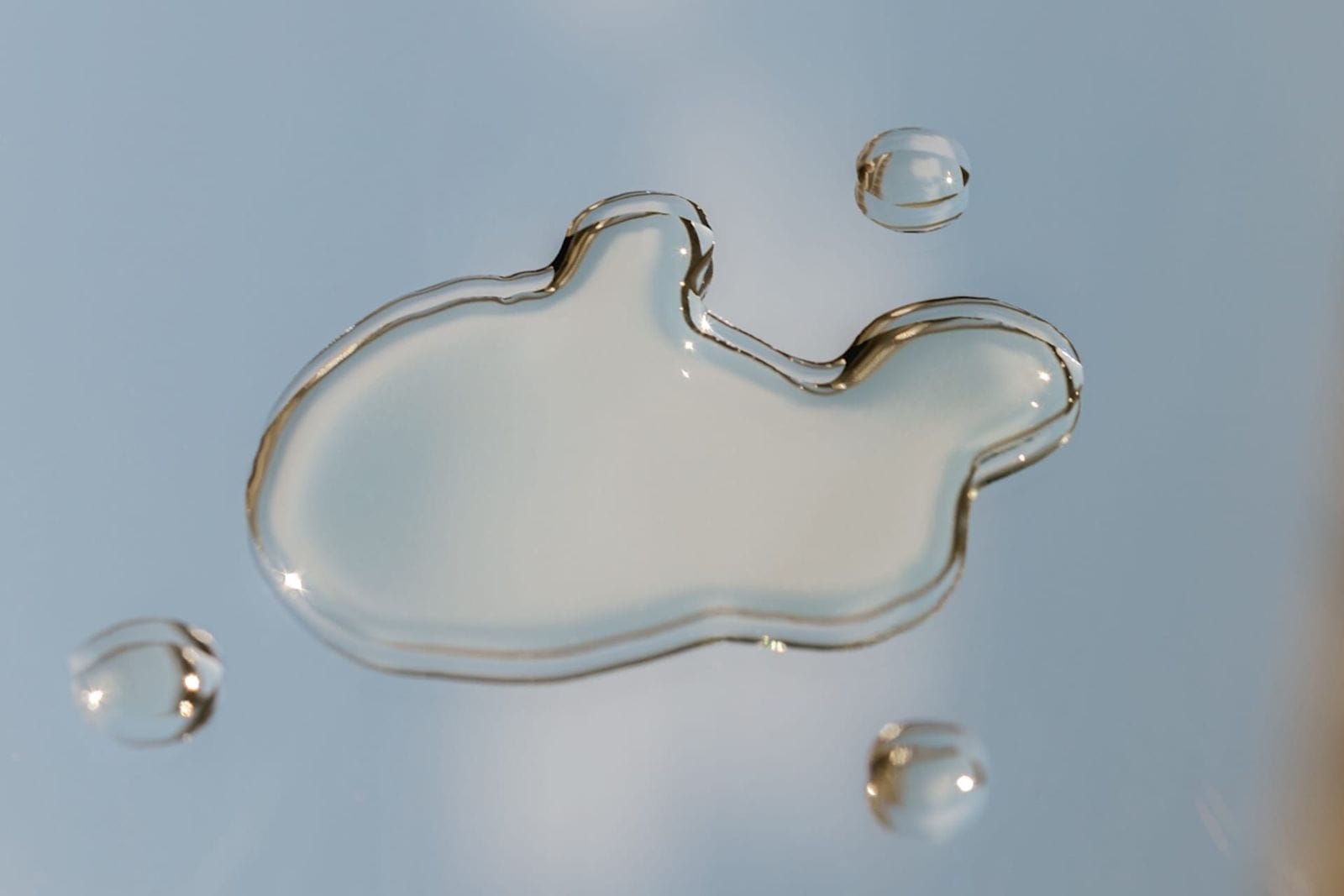 Water droplets spread across a table
