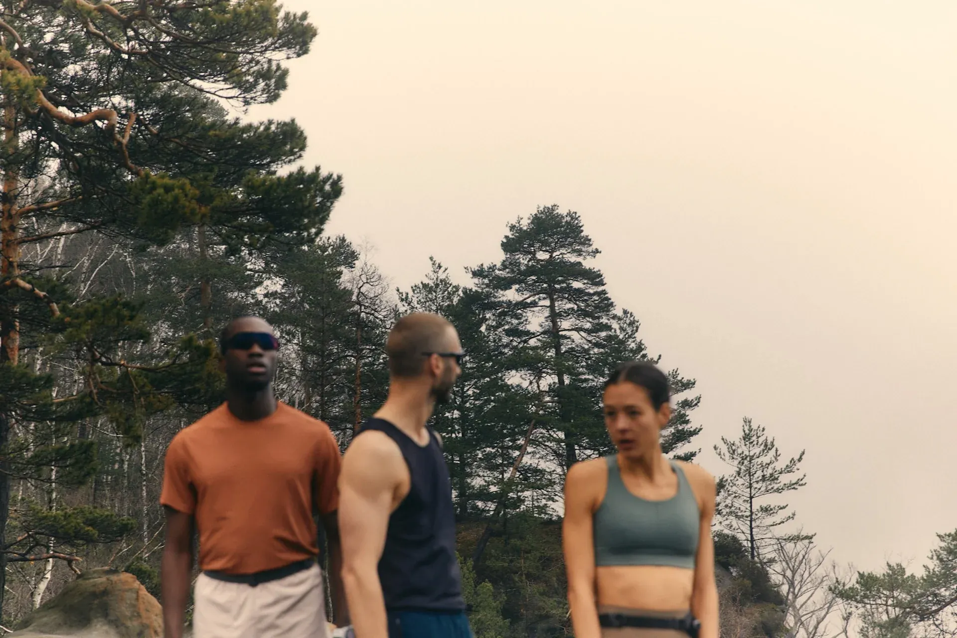 A group of three friends hiking in the mountains