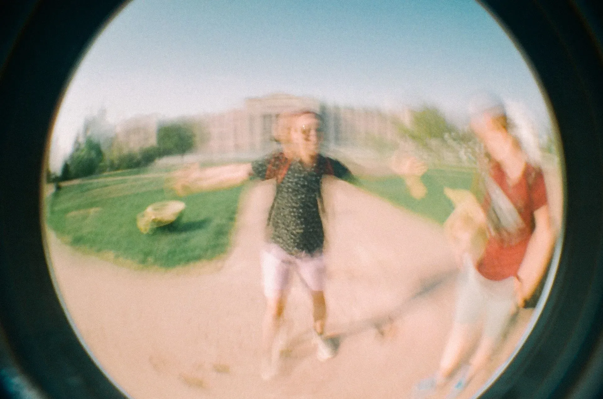 Two friends out-of-focus in a fisheye lens