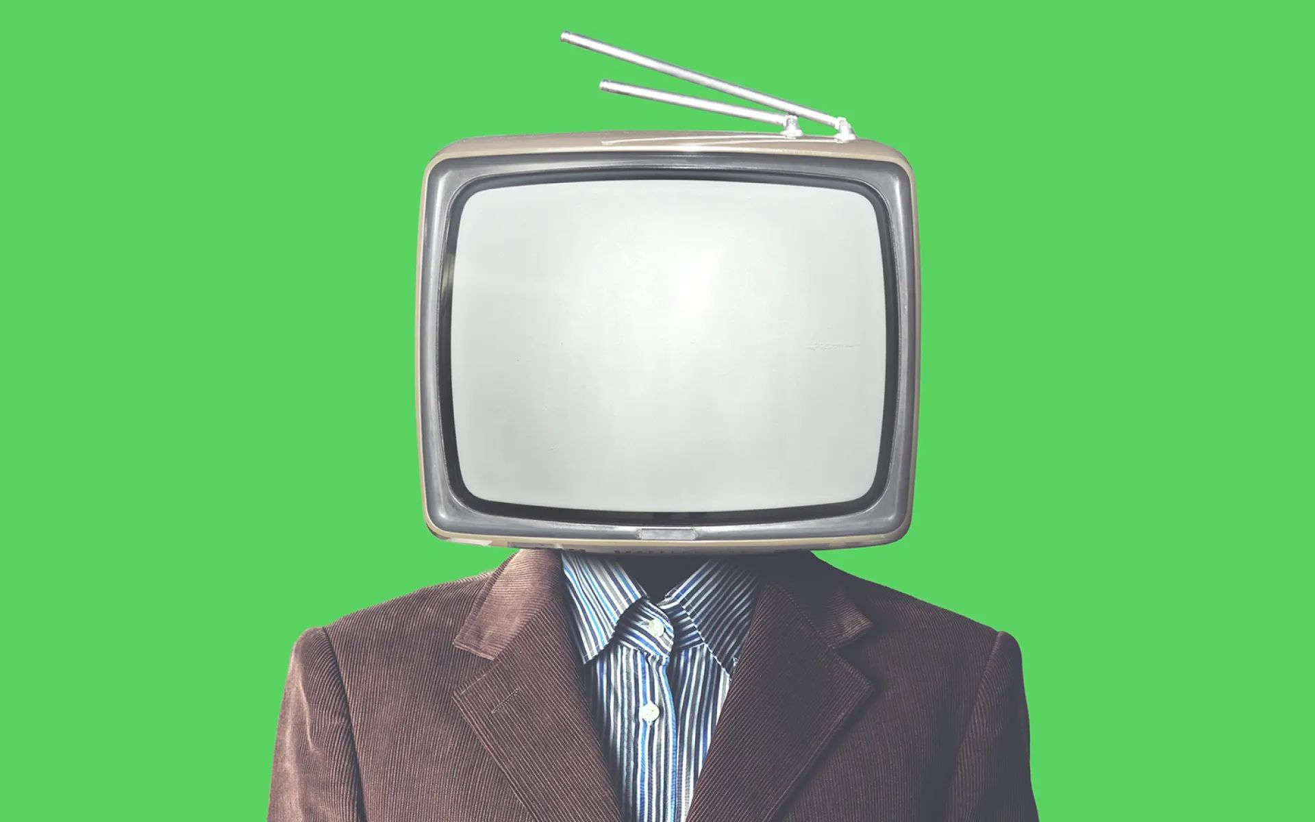 A person wearing a suit with a TV for a head