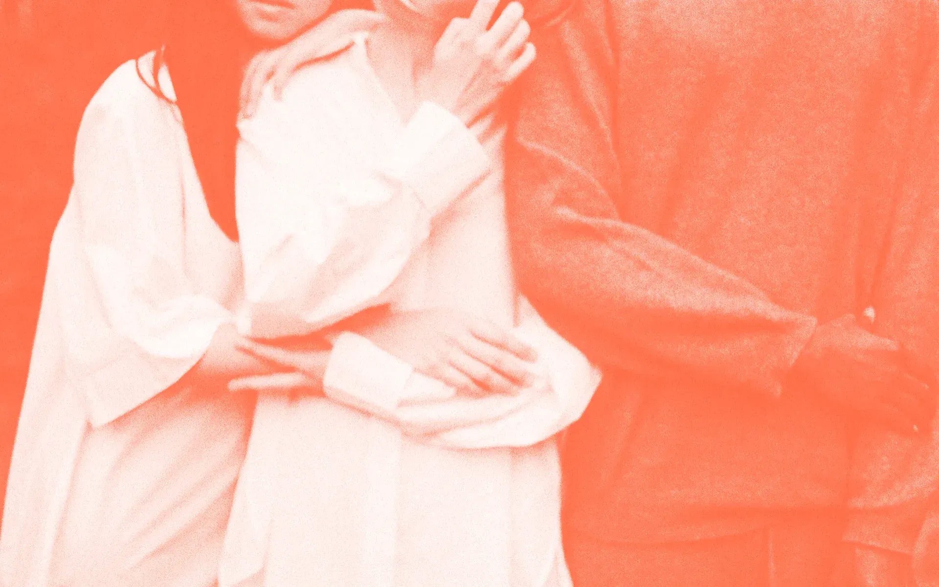 Three people huddling together