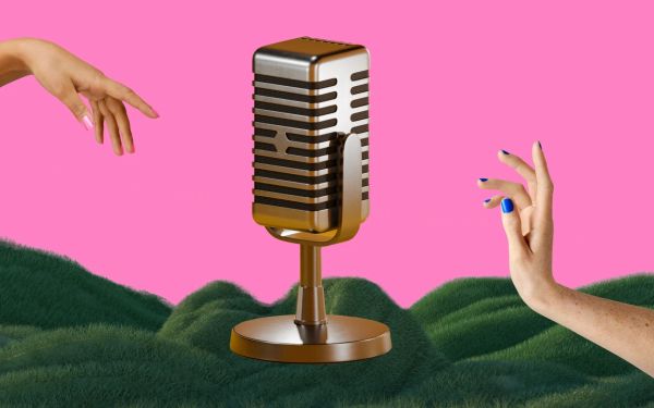 Two hands reaching for a microphone