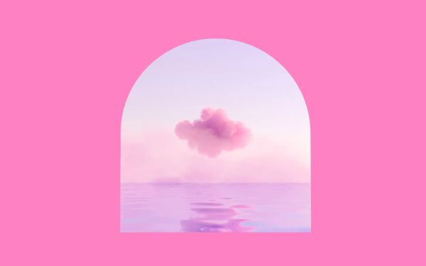 A pink cloud over some water, framed in an arch