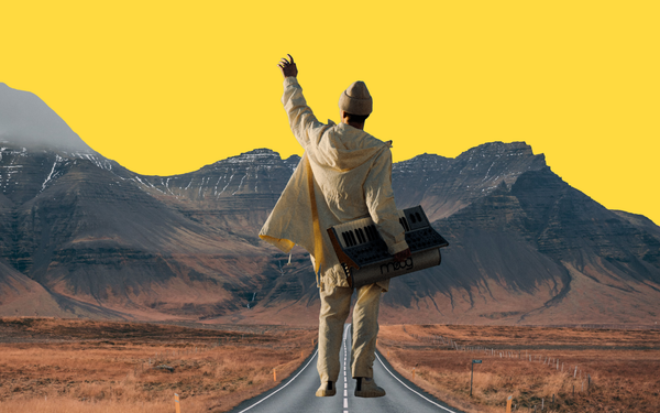 Ooyy stood on a road, surrounded by a mountain range