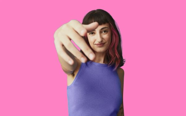 Woman pointing downward with her hand