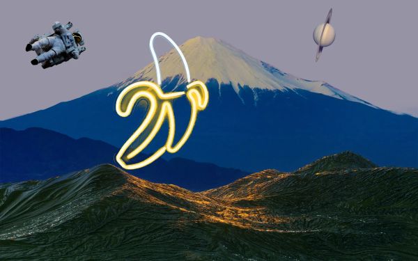 A neon banana on a mountaintop