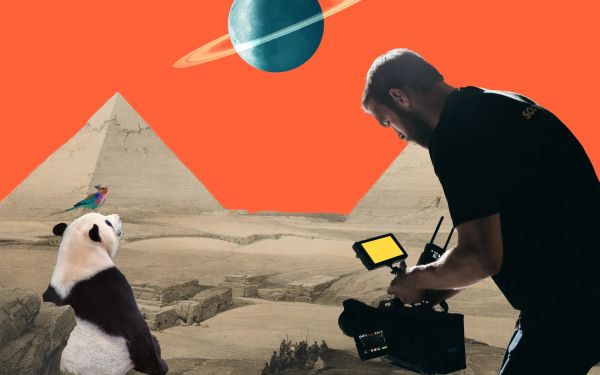 A man taking video of a panda by the pyrami