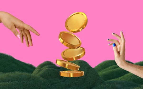 Two hands next to some giant gold coins