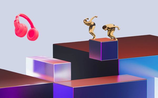 Two swimmers jumping off some cubes, with some giant headphones floating in the background