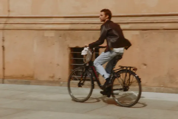 A man riding a bicycle down the street
