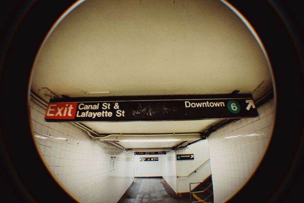 A fisheye lens view of a New York City subway station exit