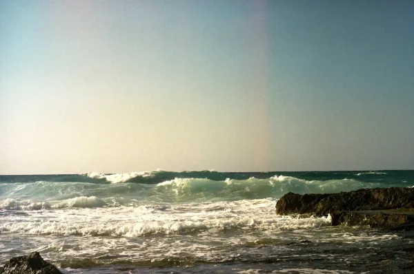 Waves crashing away from the shore.
