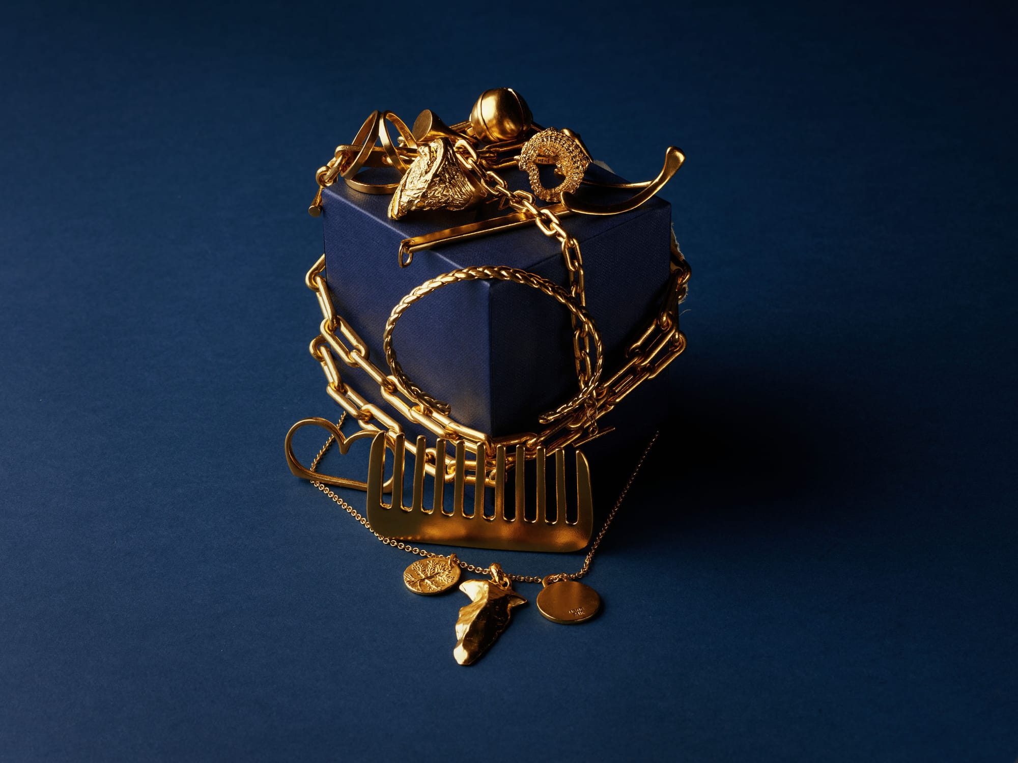 Menē 24k gold jewelry and precious objects.