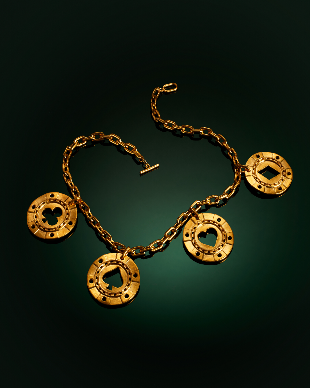 Menē 24k gold Poker Chip Necklace jewelry.