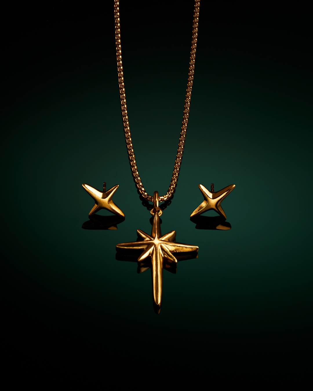 Menē 24k gold Northern Star Pendant and Northern Star Stud Earrings.