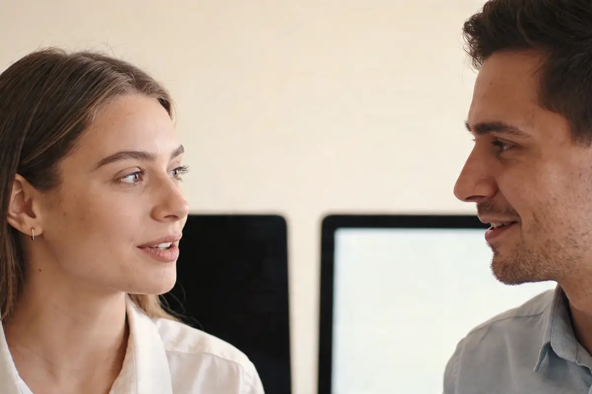 Team discussing chatbot rollout strategy in a modern office