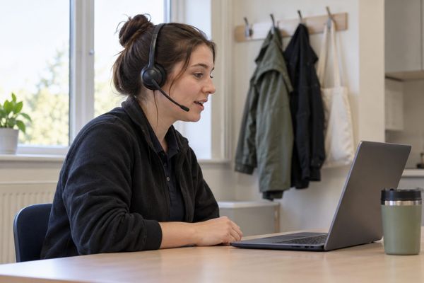 Employee practising a customer conversation aloud using a headset