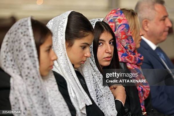 Iranian Christians attend a mass celebrating the Armenian Christmas at the Saint Sarkis Armenian Cathedral in Tehran on January 6, 2026
