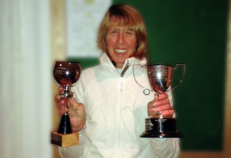 Candy with Indoor National Championship trophies