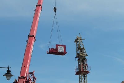 Bit by bit the tower crane is stripped down and moved out.