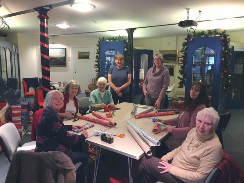 Rye Museum ladies wrapping presents for Santa's Grotto
