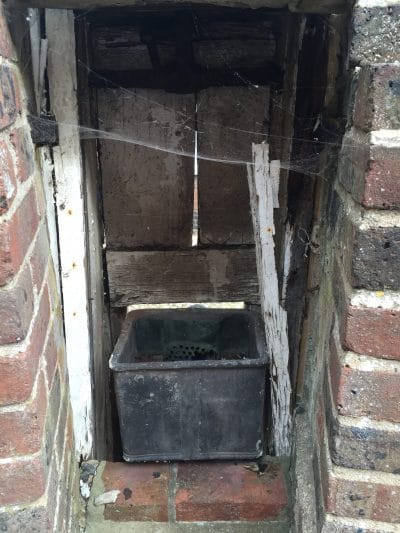 ....wood surrounds of the pump handle in the road outside ..... are beyond repair....