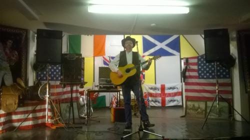 B. Grant, Country and Western singer inviting the audience to dance 