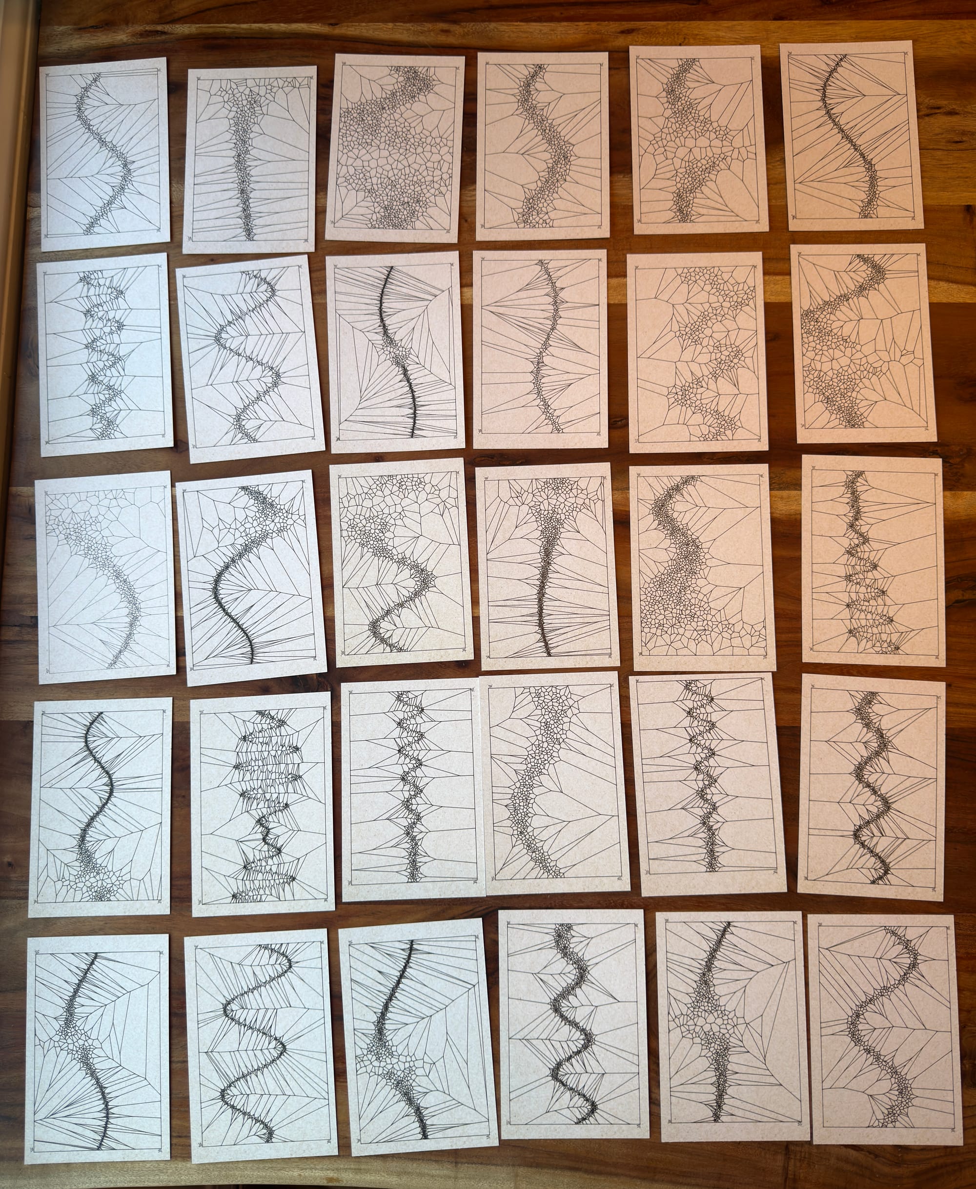 30 postcards with various amounts of waviness with voronoi cells that are small and concentrated along sinusoidal-like curves. The prompt originially was plate technonics, so there is a sense of pulling apart with some areas that feel like ruptures. 