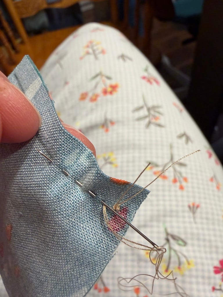 2 inch quilt pieces getting sewn together in a close up
