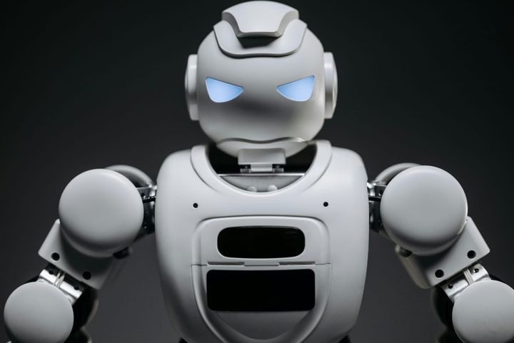 a white robot with a faintly disapproving face