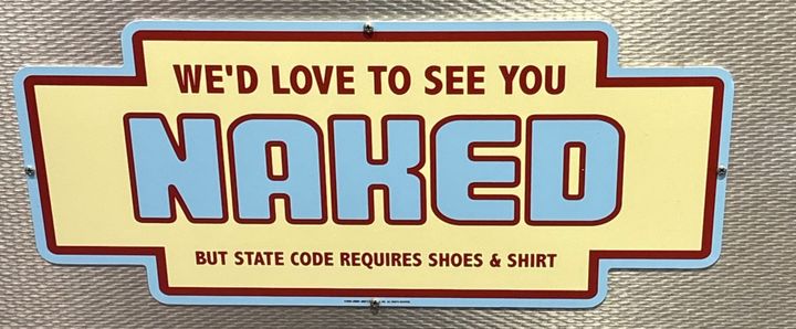 A sign in a Jimmy John's restaurant reads, "We'd love to see you naked but state code requires shoes and shirt."
