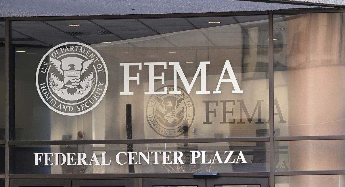 Signs above the door for FEMA at Federal Center Plaza