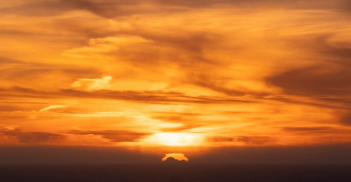 A hazy sunset with clouds