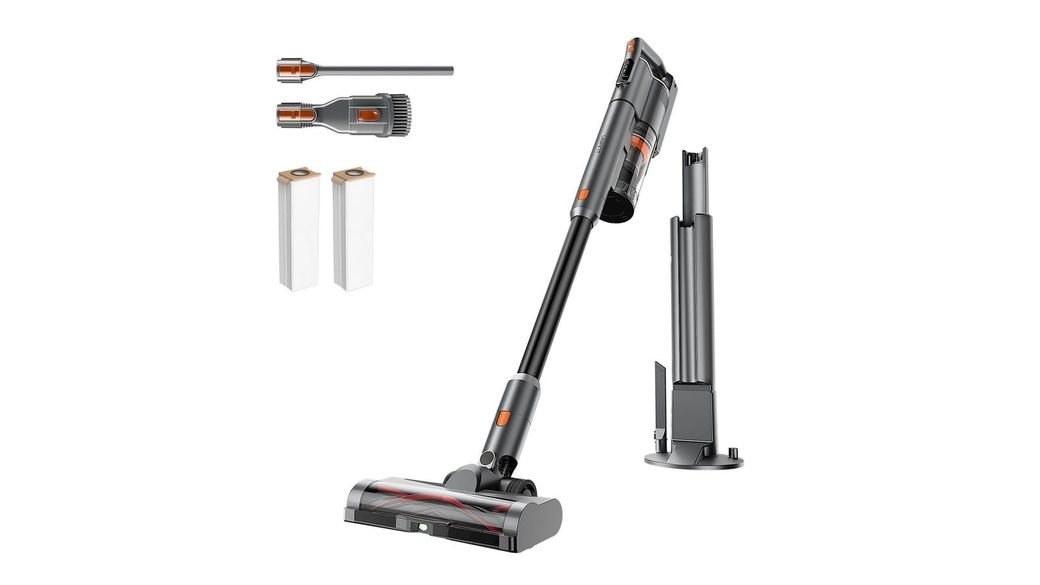 UWANT V500 cordless stick vacuum next to its self-emptying base station, with a crevice tool, a brush tool and two dust bags