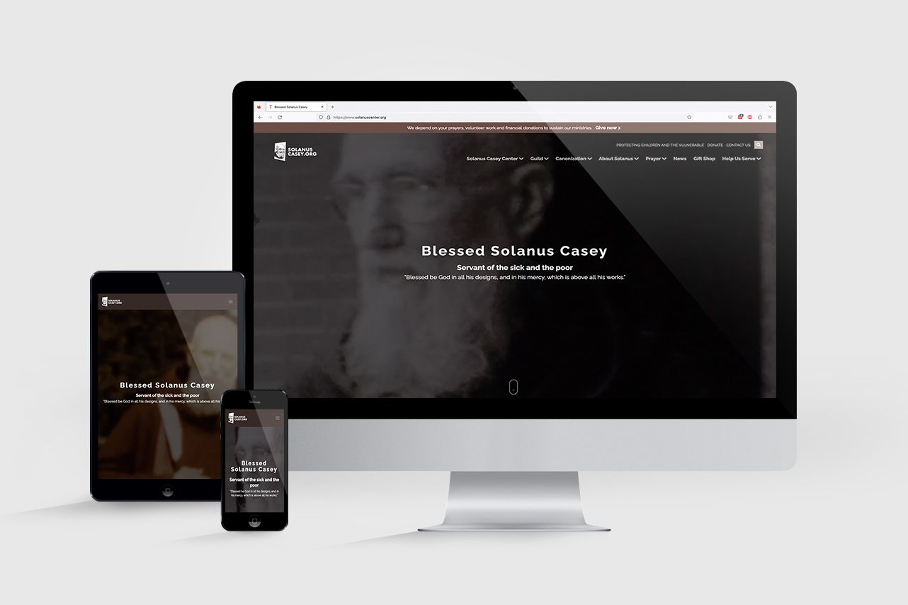 A mockup showing the home page of the new Solanus Casey website on a computer screen, smartphone and tablet.