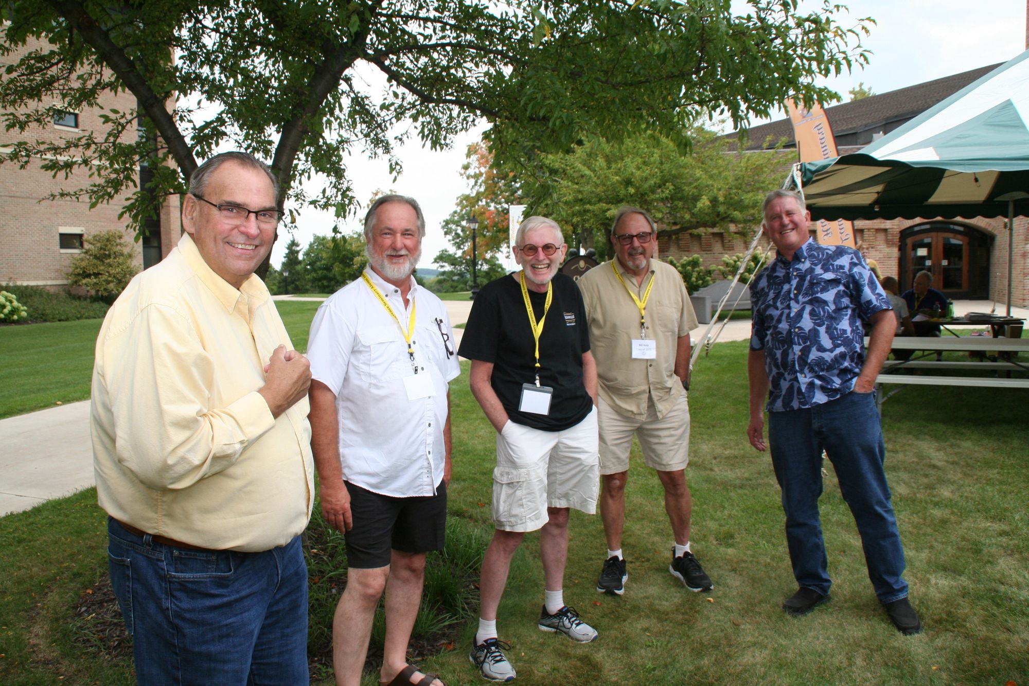 Landscape color photo of a group of alumni of St. Lawrence Seminary outdoors during the Hilltopper.