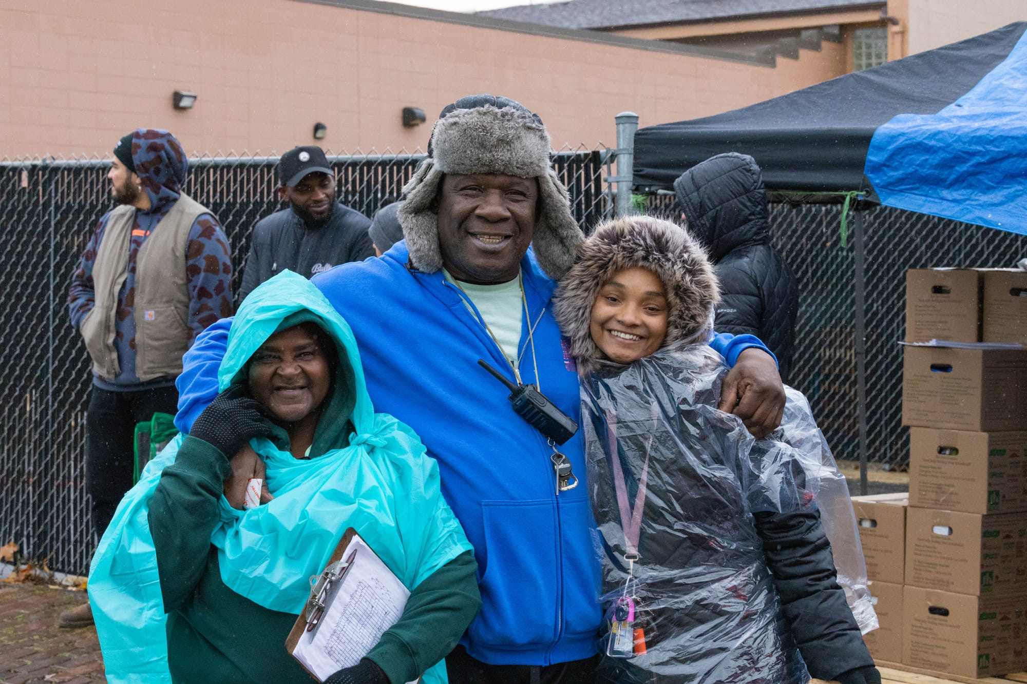 Staff and volunteers work together with community partners such as the Milwaukee Bucks to distribute turkeys and holiday food boxes at the House of Peace in Milwaukee.