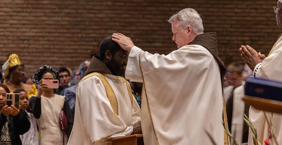 Provincial Minister Br. Mark Joseph Costello, OFM Cap. lays his hands on Br. Baudry Metangmo, OFM Cap. during the latter's presbyteral ordination.