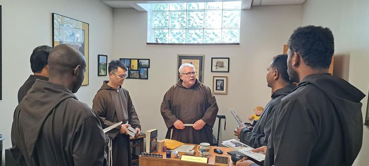 Br. Gary and Br. Tien greet the new friars from Africa and India and explain a bit about the Capuchin Soup Kitchen.